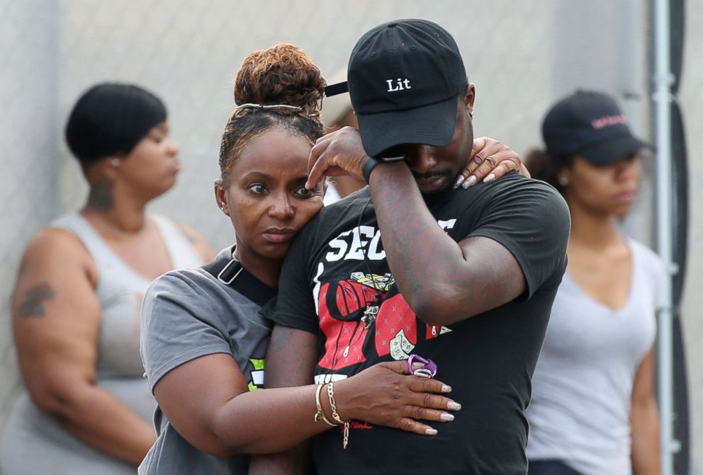 PHOTO: A man wipes his eyes outside the Stroger Hospital in Chicago, after leaving the emergency room due to overwhelming crowds of family and friends of shooting victims Aug. 5, 2018.