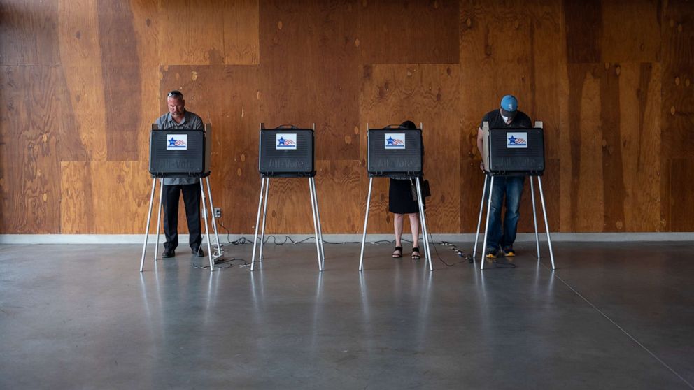 PHOTO: Voters cast their ballots on Primary Day at the No. 571 Boathouse, June 28, 2022, in Chicago.