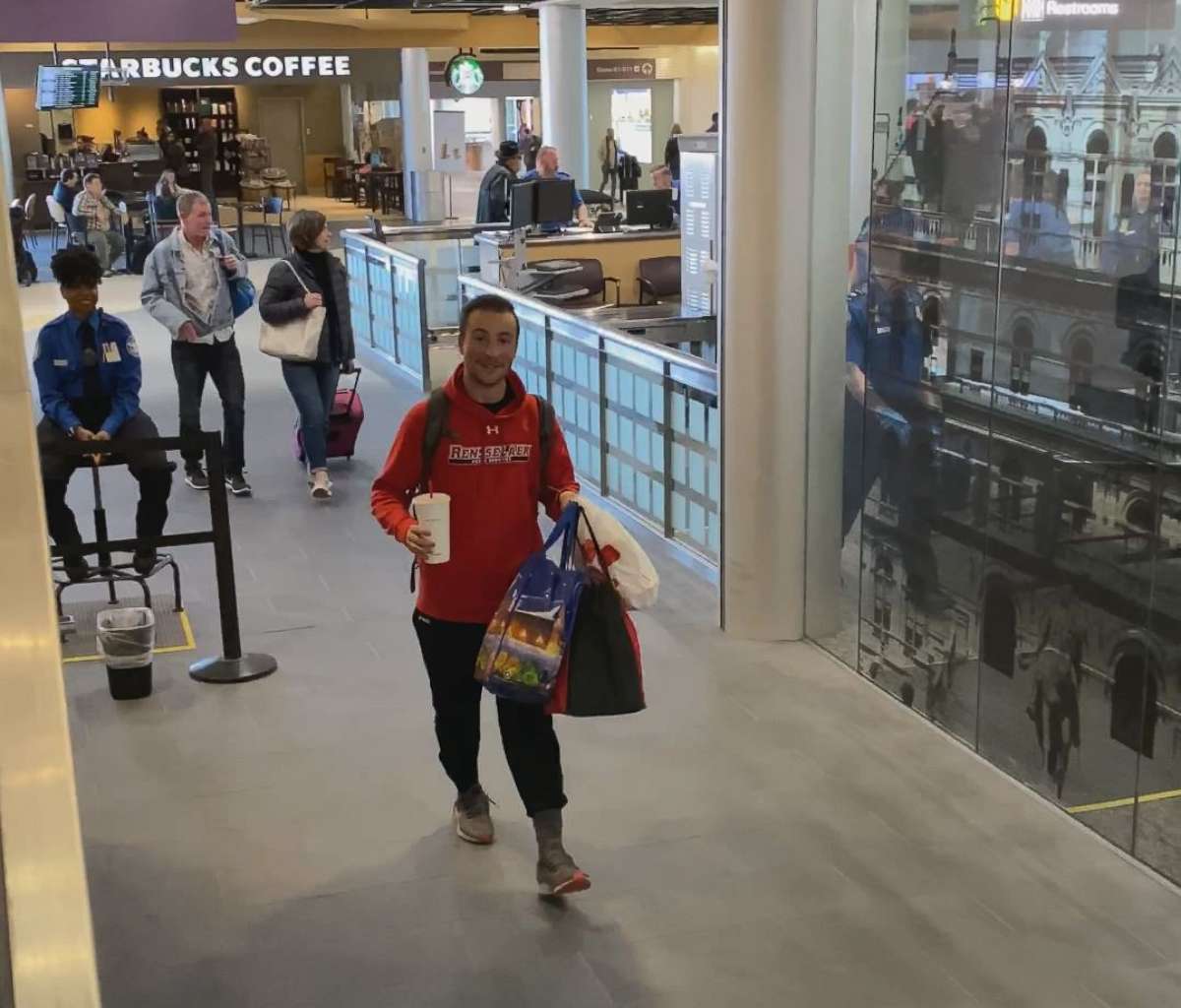 PHOTO: Rensselaer Polytechnic Institute senior Vincent Putrino exits the security area of Albany Airport after purchasing a one-way plane ticket in order to get lunch for 18 cross country teammates at the airport's Chick-fil-A restaurant, Feb. 22, 2020.