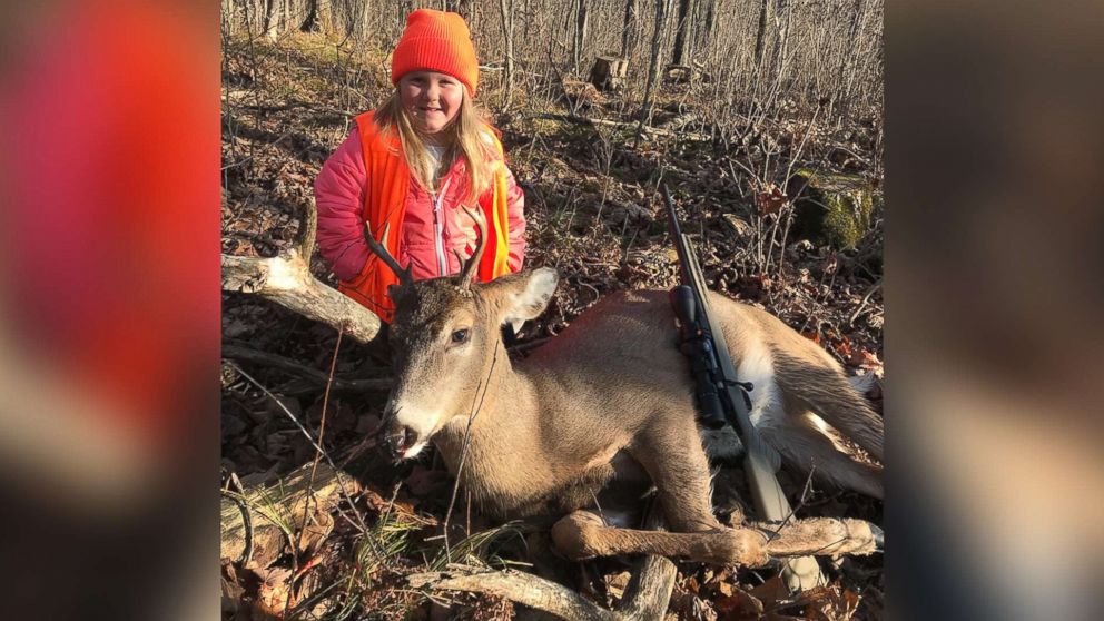 Lexie Harris, 6, poses after bagging a buck in Taylor County, Wis., Nov. 19, 2017. Lexie is among the first youngsters to bag a buck under the state's new law that eliminates the state's minimum hunting age.