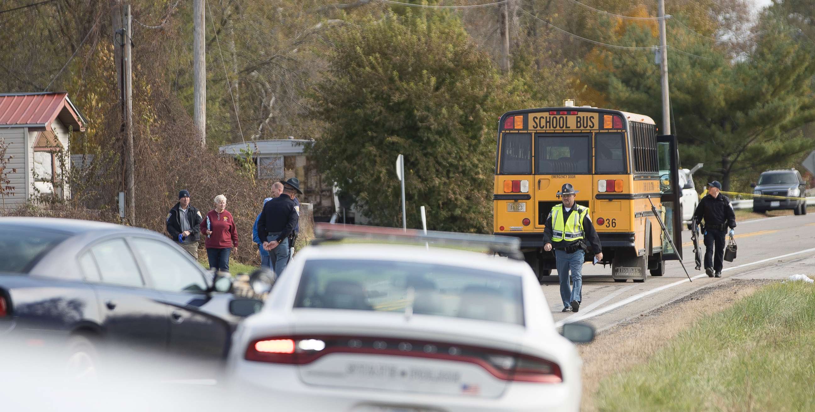 PHOTO: Emergency personnel respond to a scene of a collision that killed three children crossing the road as they were boarding their school bus north of Rochester, Ind., Oct. 30, 2018.