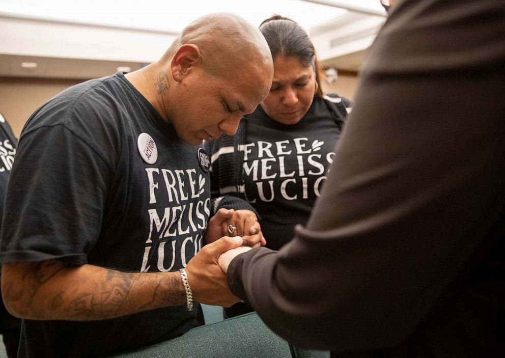 PHOTO: John Lucio, with his wife Michelle Lucio, prays with Jennifer Allmon, right, Executive Director of the Texas Catholic Conference of Bishops, before a hearing  about his mother, death row inmate Melissa Lucio, in Austin, Texas, on April 12, 2022. 