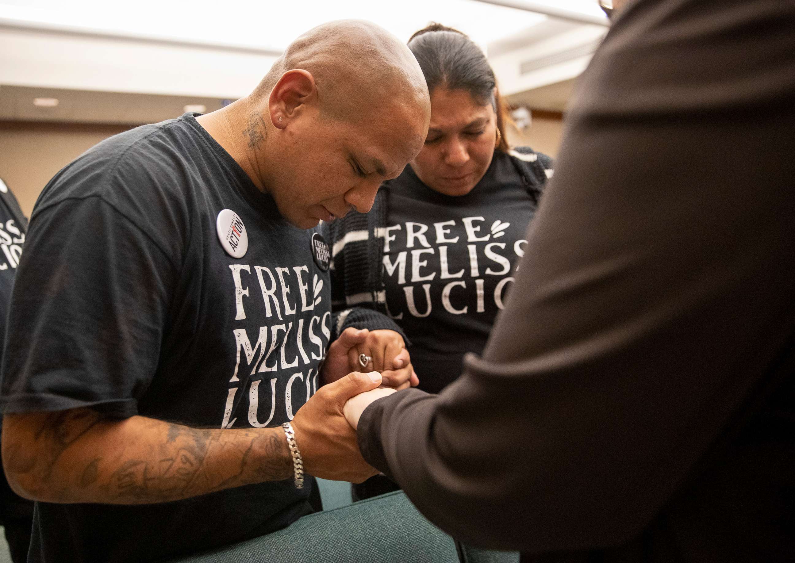 PHOTO: John Lucio, with his wife Michelle Lucio, prays with Jennifer Allmon, right, Executive Director of the Texas Catholic Conference of Bishops, before a hearing  about his mother, death row inmate Melissa Lucio, in Austin, Texas, on April 12, 2022.