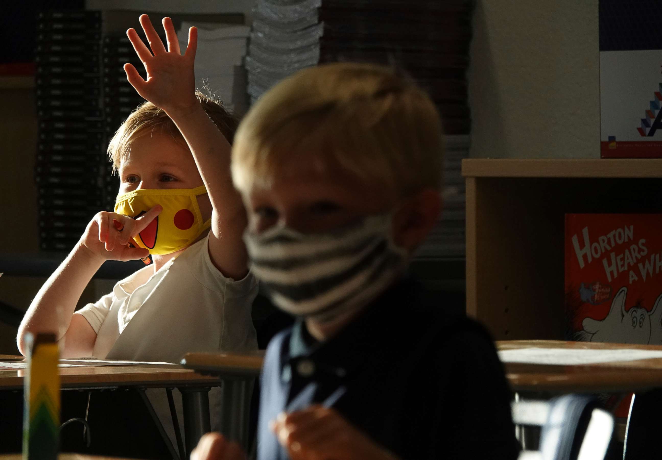 PHOTO: First Graders Alex Albin, left, and Tyler Custodio wear masks at the Addison Mizner School in Boca Raton, Fla., Aug. 10, 2021. Palm Beach County Schools opened the school year with a masking requirement with an opt-out option.