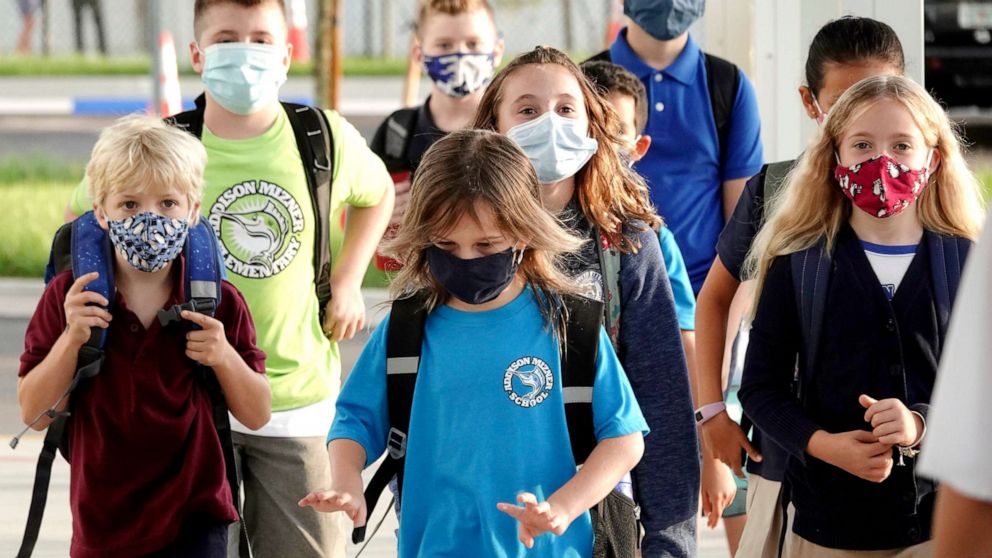 PHOTO: Students arrive to school on the first day at the Addison Mizner School in Boca Raton, Fla., Aug. 10, 2021. Palm Beach County Schools opened the school year with a masking requirement with an opt-out option.