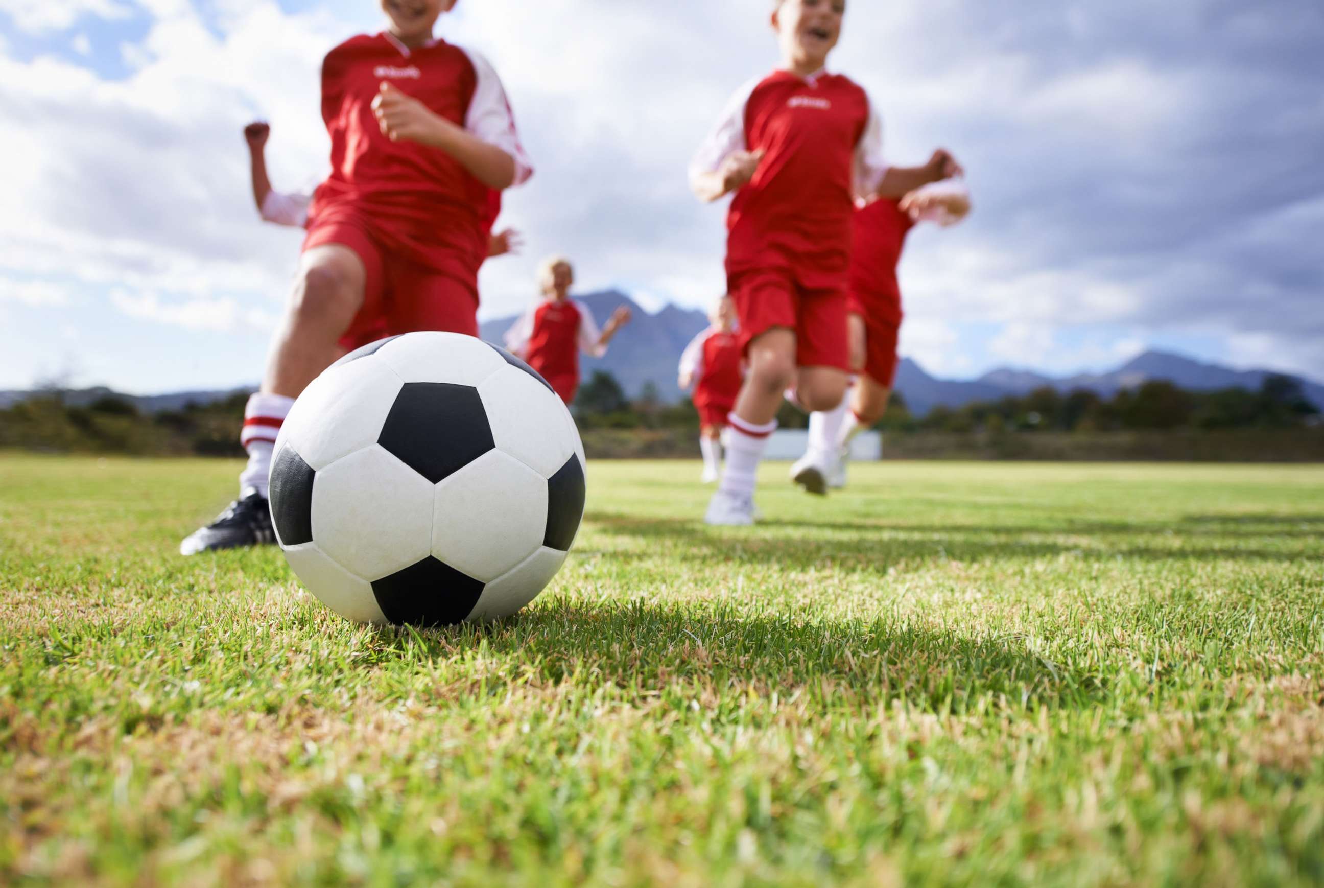 PHOTO: Children kick a soccer ball in an undated stock photo.