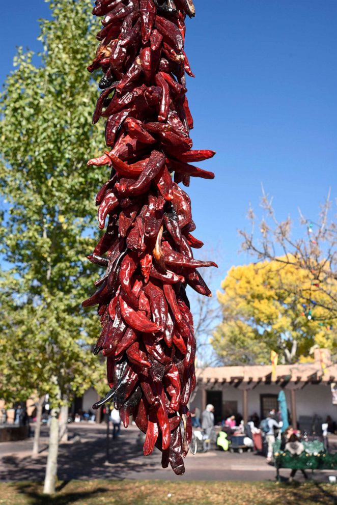 PHOTO: A decorative string of dried red chile pods, a ristra, hangs in the Plaza in Santa Fe, N.M., Nov. 11, 2017. 
