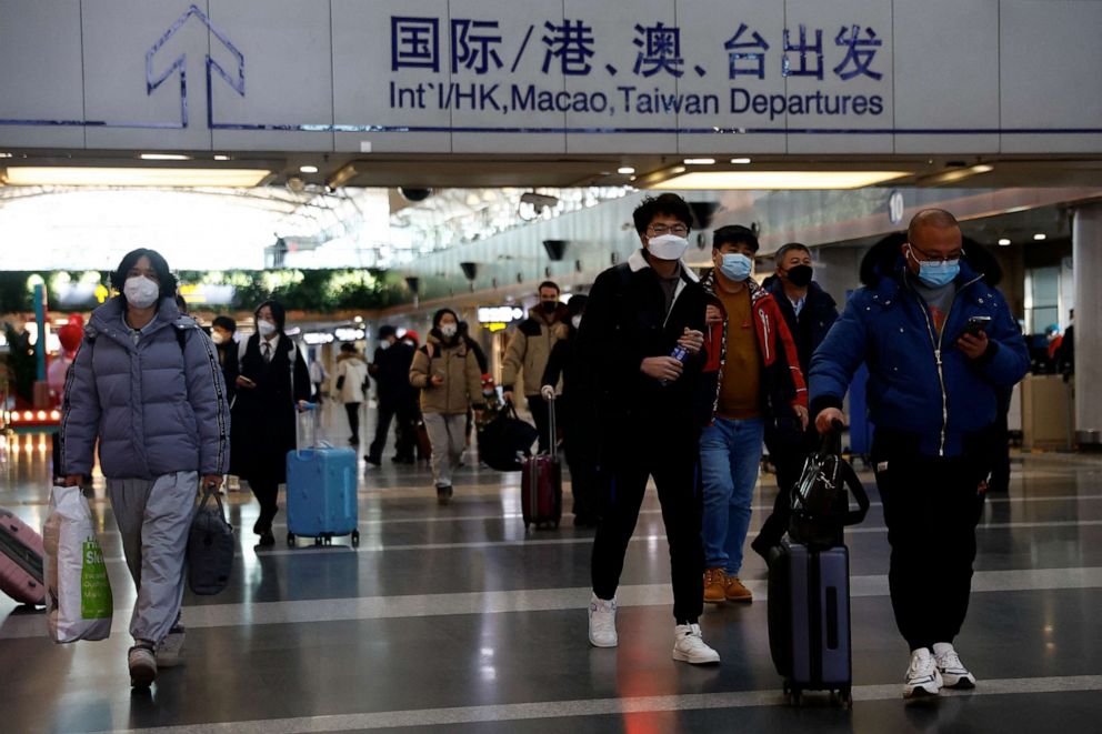 PHOTO: Travelers walk through the Beijing Capital International Airport, Dec. 27, 2022, in Beijing, China.