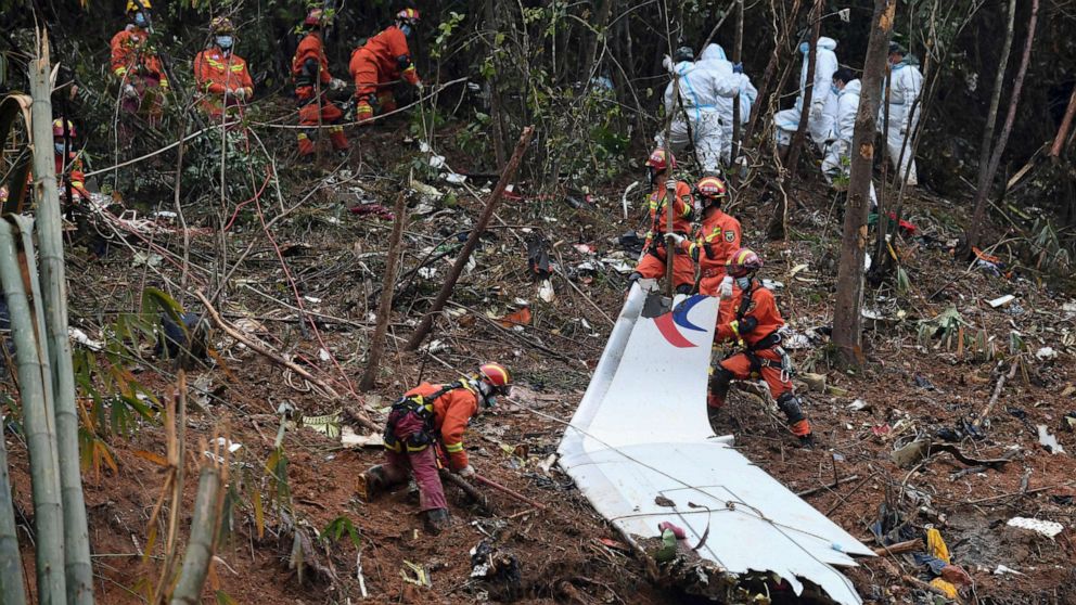 PHOTO: In this photo released by Xinhua News Agency, workers search through debris at the China Eastern flight crash site in Tengxian County in southern China's Guangxi Zhuang Autonomous Region, March 24, 2022.