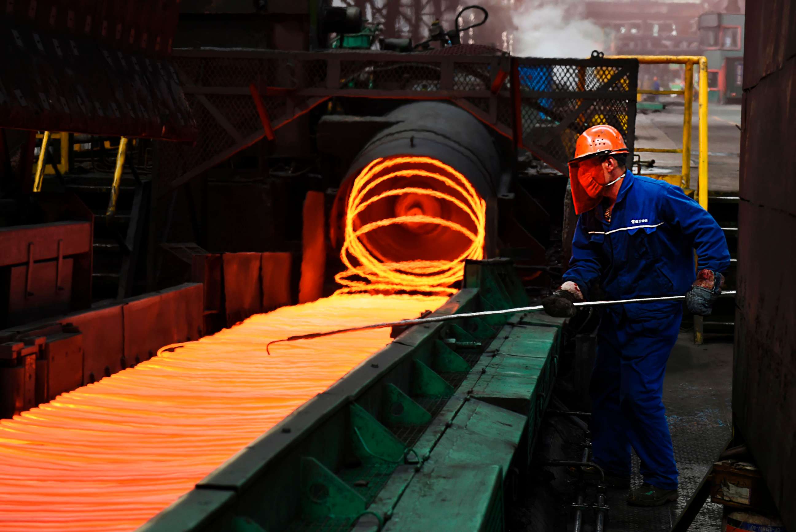 PHOTO: An employee sorts hot red steel at a steel plant in Zouping in China's eastern Shandong province on March 5, 2018.