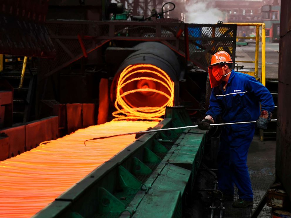 PHOTO: An employee sorts hot red steel at a steel plant in Zouping in Chinas eastern Shandong province on March 5, 2018.