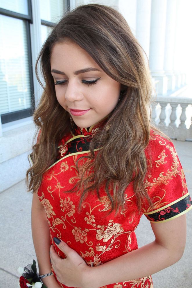 PHOTO: Keziah Daum, an 18-year-old senior at Woods Cross High School, Utah, is pictured in a red qipao, a traditional Chinese dress, on prom night.