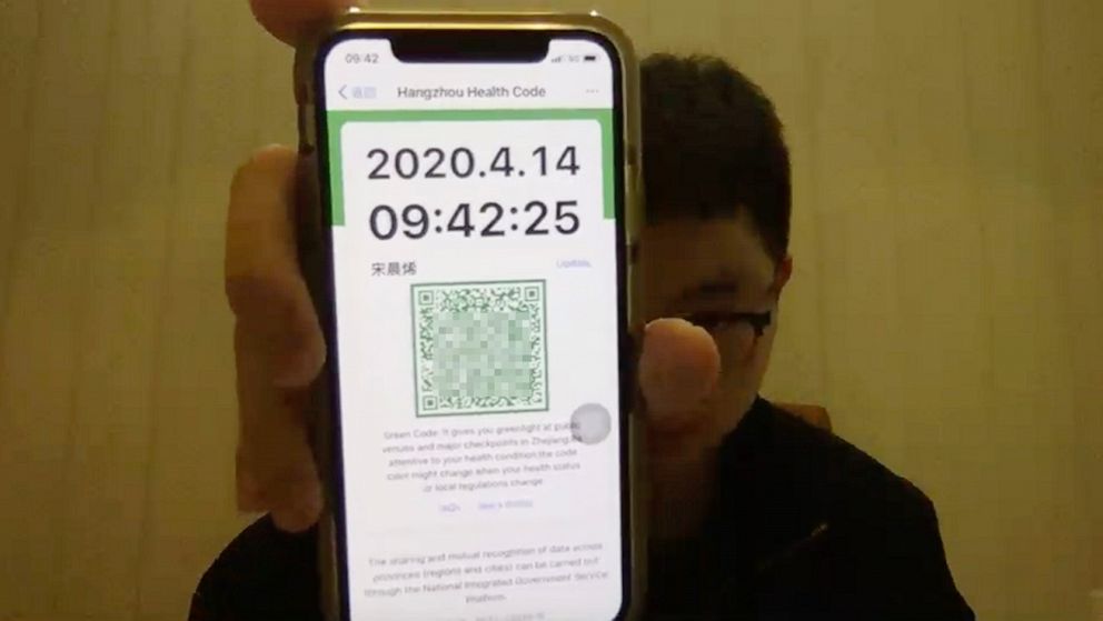 PHOTO: Steven Song, a high school student at Shattuck-St. Mary's School in Fairbault, Minn., shows his "green code" health status at home in Hangzhou, China. The app tracks COVID-19 test results; residents are required to show their code at checkpoints.