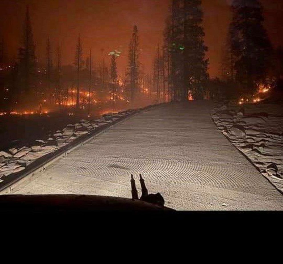 PHOTO: In this Saturday, Sept. 5, 2020, photo released by the California National Guard, shows the view from a Cal Guard Chinook helicopter last night rescuing people trapped after the Creek Fire in central California left them stranded. 