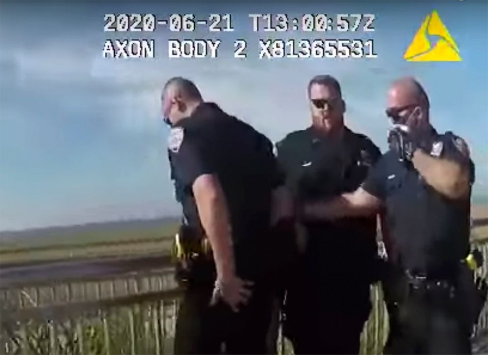PHOTO: In this photo taken from police body cam video, New York Police officers, including officer David Afanador, right, arrest a man on a boardwalk in New York's Rockaway Beach on Sunday, June 21, 2020.