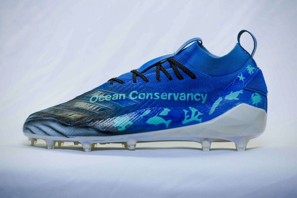 PHOTO:  The cleats for Jacksonville Jaguars wide receiver Chris Conley feature waves and a humpback whale, which represent his love of surfing.