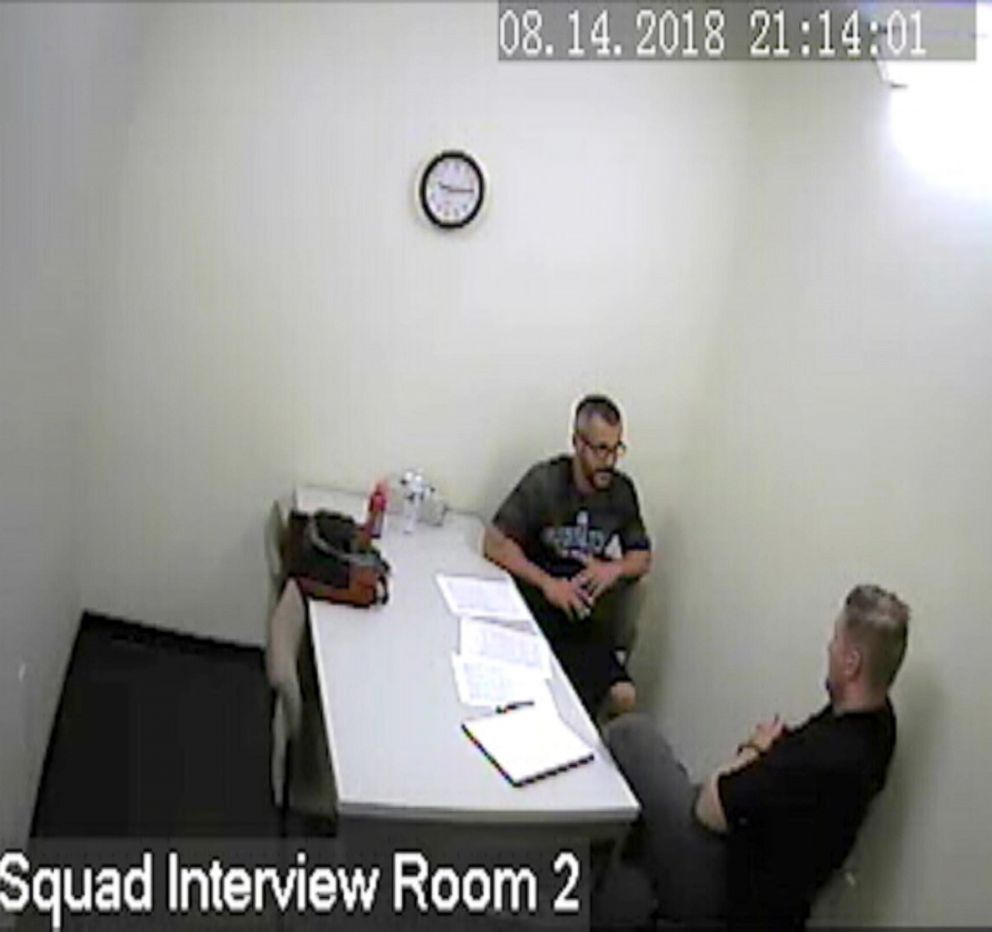 PHOTO: Chris Watts speaks with investigators after being arrested for the murder of his wife and two children in police surveillance released, Nov. 29, 2018.