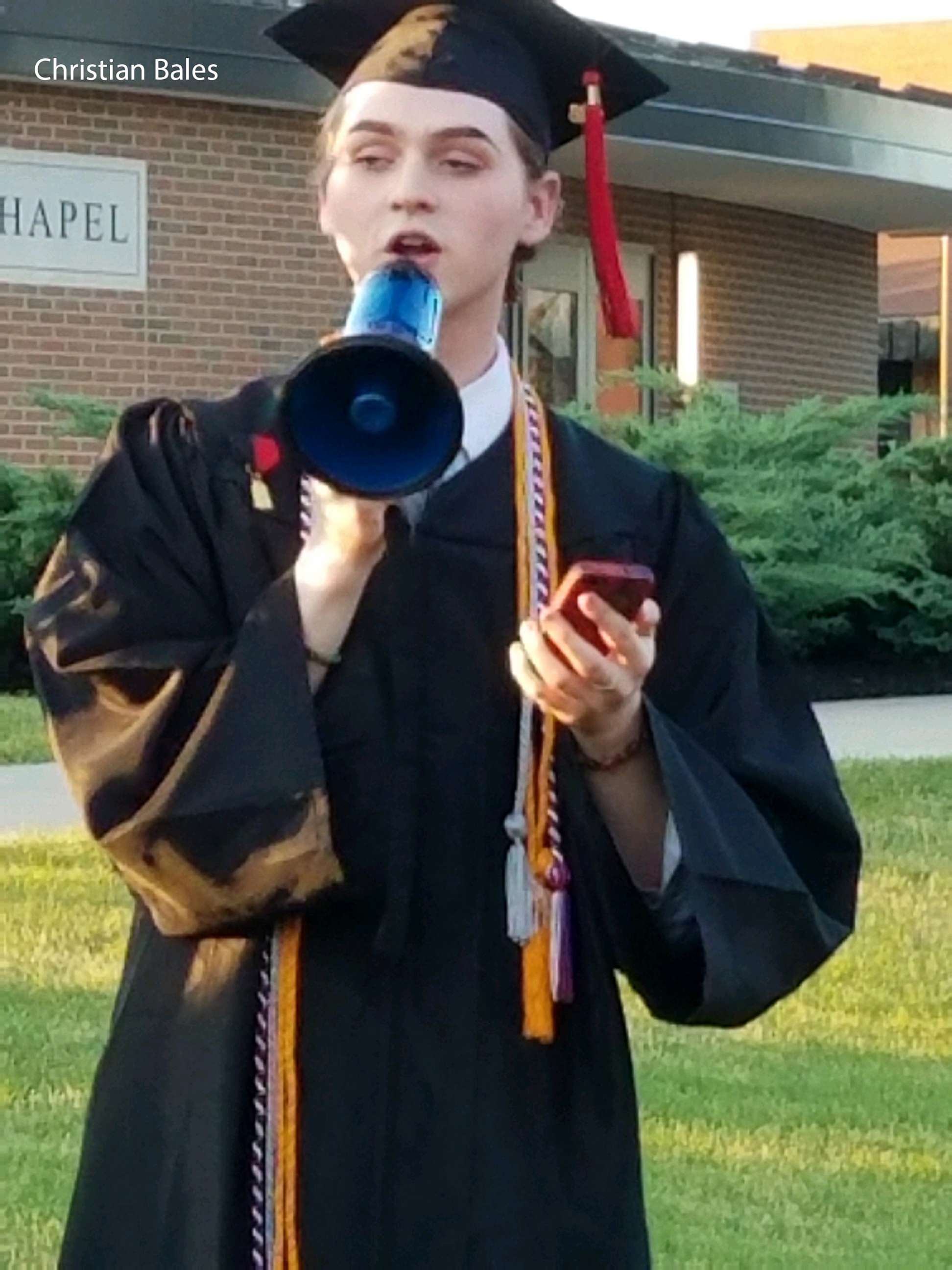 PHOTO: Holy Cross High School's graduating valedictorian and student council president Christian Bales delivers his speech outside after the ceremony, May 25, 2018, in Covington, Ky.