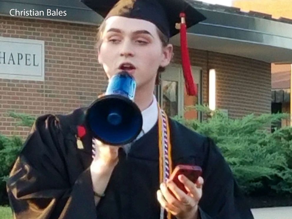PHOTO: Holy Cross High Schools graduating valedictorian and student council president Christian Bales delivers his speech outside after the ceremony, May 25, 2018, in Covington, Ky.