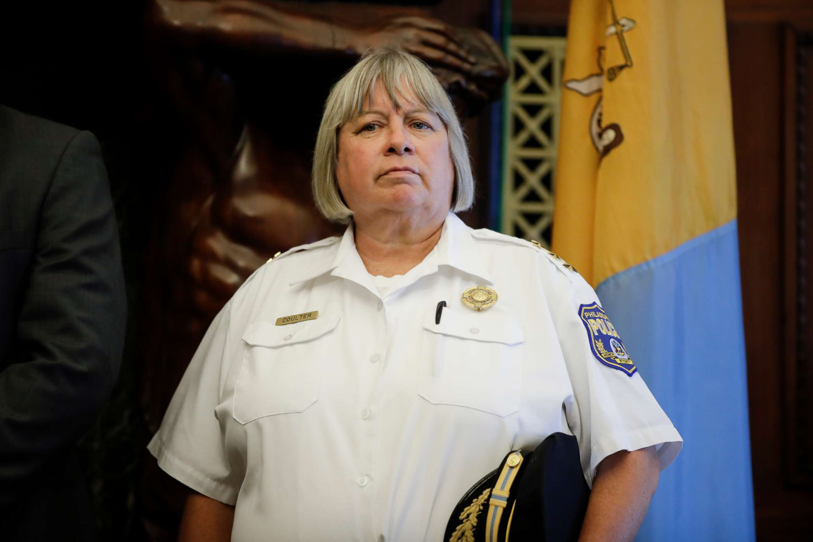 PHOTO: Philadelphia's acting Police Commissioner Christine Coulter listens as Mayor Jim Kenney speaks with members of the media during a news conference at City Hall in Philadelphia, Aug. 21, 2019.