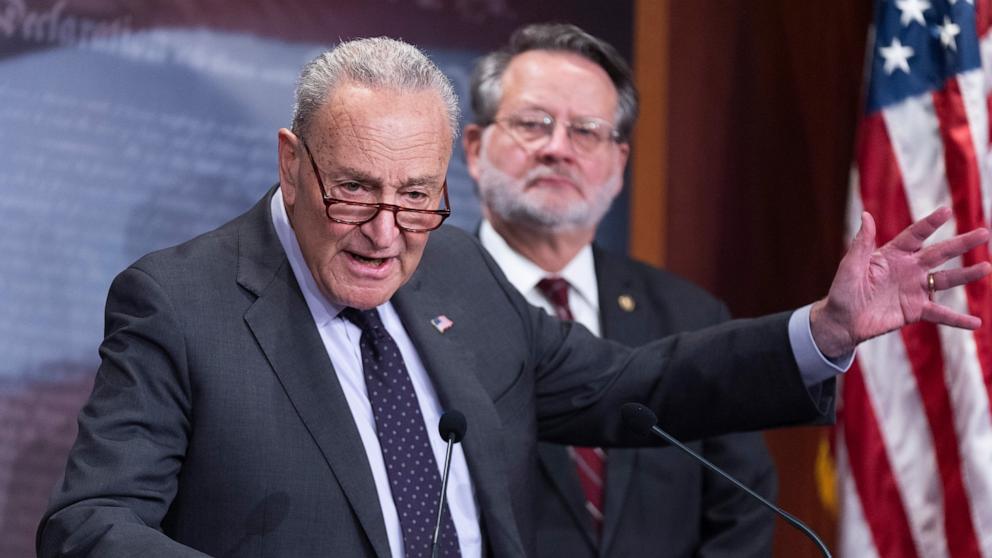 PHOTO: Senate Minority Leader Chuck Schumer and Sen. Gary Peters speak to reporters about federal grants and loans, at the Capitol, Jan. 29, 2025 in Washington.