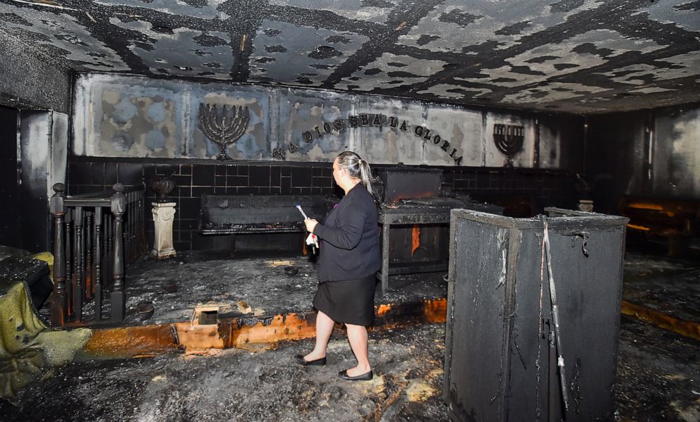 PHOTO: Elizabeth Collazo, the daughter of Pastor Carmen L. Cruz, crosses the church badly damaged after the fire of Iglesia Pentecostal church of Bethlehem, April 23, 2019, in Allentown, in the # State of Pennsylvania.