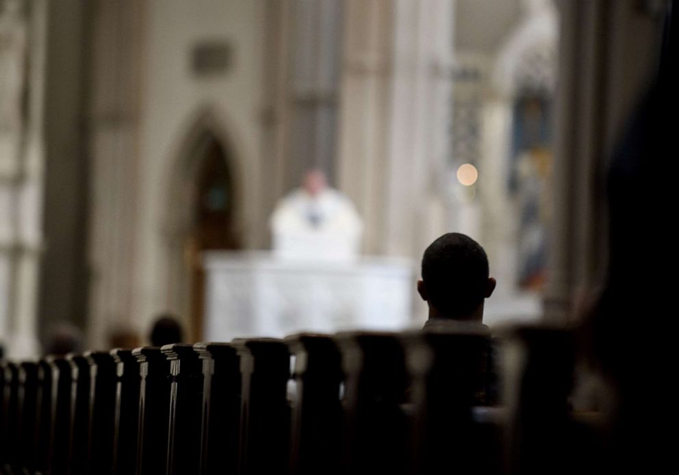 PHOTO: Parishioners worship during a mass to celebrate the Assumption of the Blessed Virgin Mary at St Paul Cathedral, the mother church of the Pittsburgh Diocese, Aug. 15, 2018, in Pittsburgh.