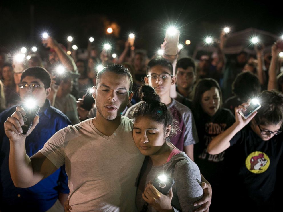 PHOTO: Matthew Mata and Erika Gonzalez participate in a memorial service for the victims of Sundays church shooting in Sutherland Springs, Texas, Nov. 6, 2017.