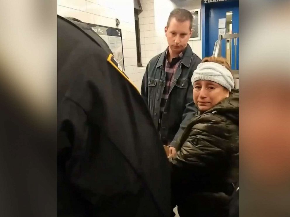 PHOTO: Police handcuff woman selling churros in Brooklyn subway station in New York, Nov. 9, 2019.