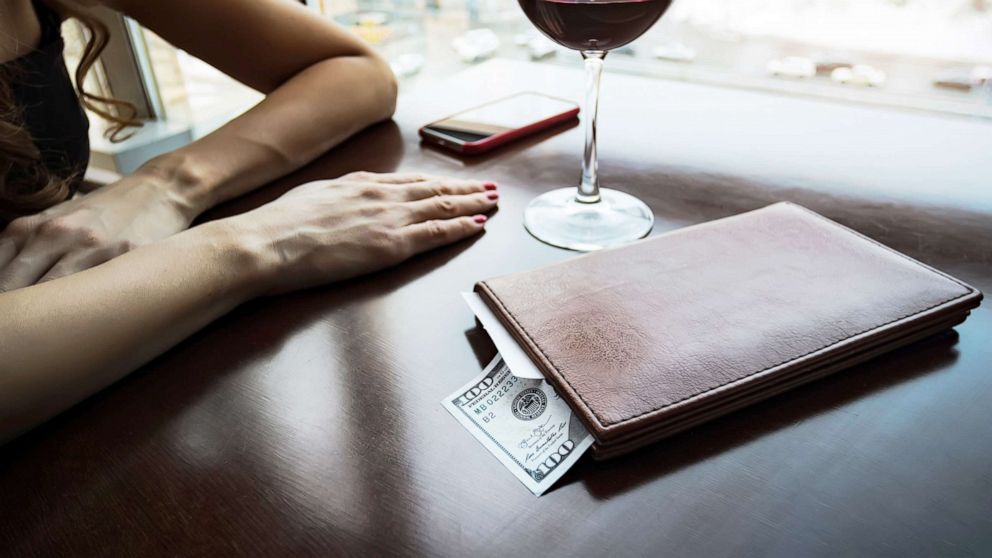 PHOTO: A hundred dollars generous tip sits on the table in a leather folder in an undated stock image.