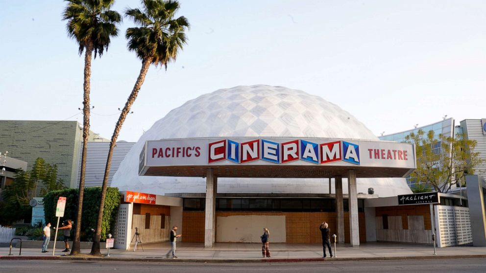 PHOTO: Bystanders gather outside the Cinerama Dome movie theater, Monday, April 12, 2021, in Los Angeles. 