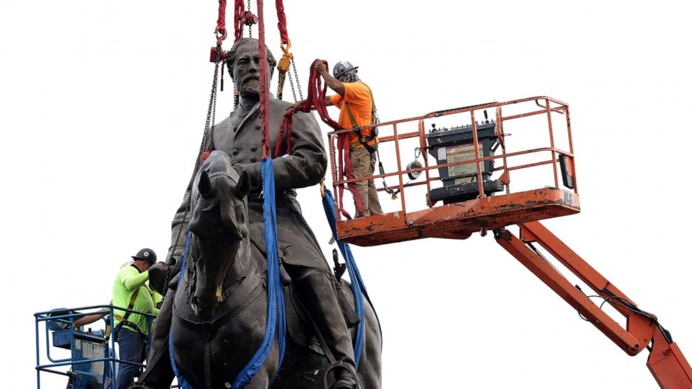 PHOTO: Workers tie up the statue of Robert E. Lee at the Robert E. Lee Memorial prior to its removal in Richmond, Va., Sept. 8, 2021.