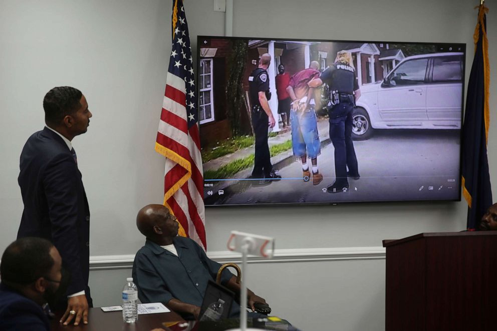 PHOTO: Attorney Justin Bamberg, left and and his client Clarence Gailyard, right, watch police body camera video of an officer stomping Gailyard in the neck as Bamberg holds a news conference on Aug. 3, 2021, in Orangeburg, S.C.