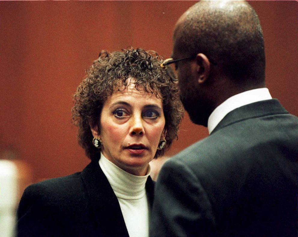 PHOTO: Lead prosecutor Marcia Clark (L) talks with fellow prosecutor Christopher Darden during court proceedings, Jan. 26, 1995, in Los Angeles.