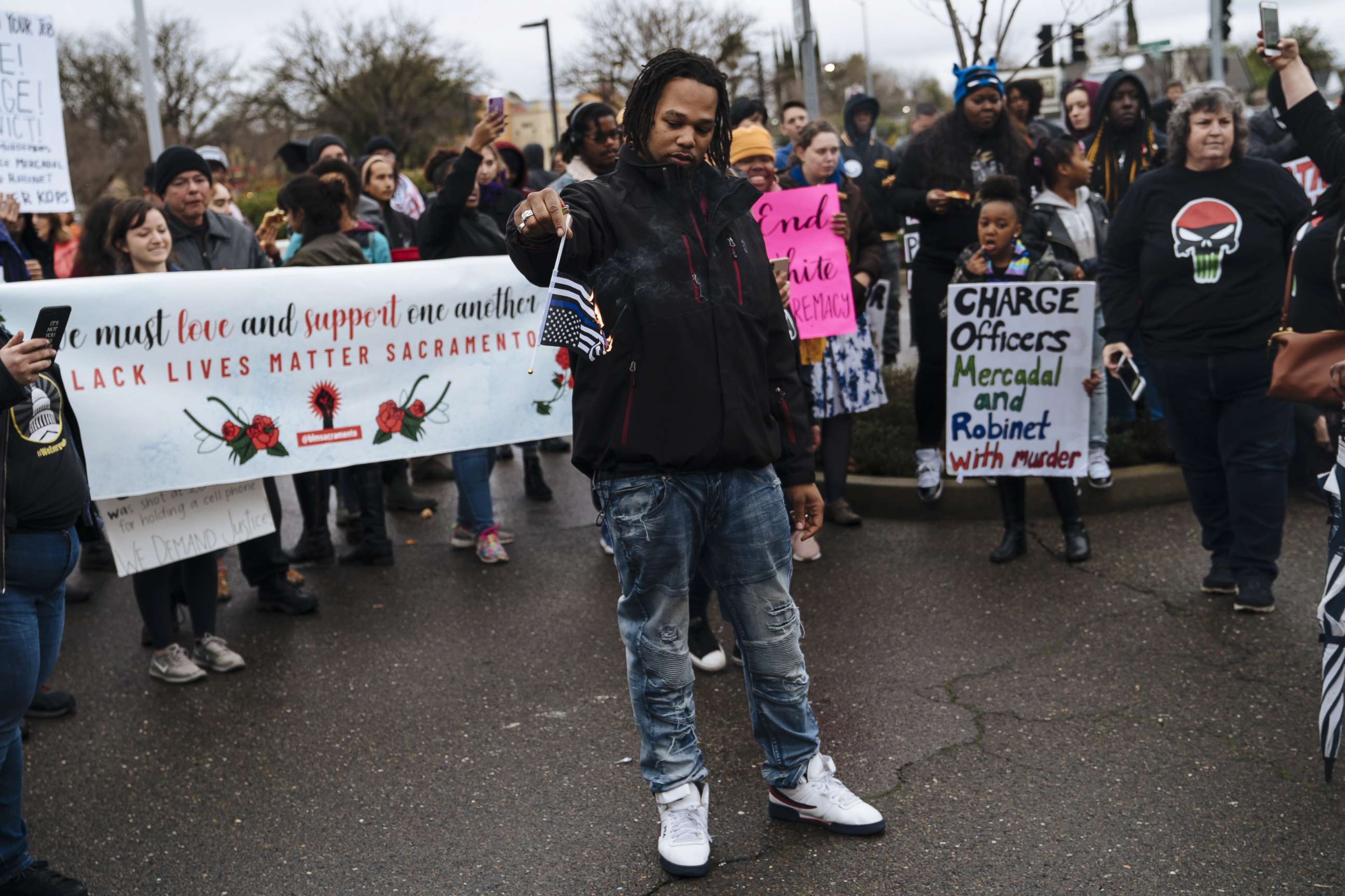 PHOTO: Demonstrators burned Thin Blue Line flags outside Sacramento Police Department, March 2, 2019, in Sacramento, Calif.