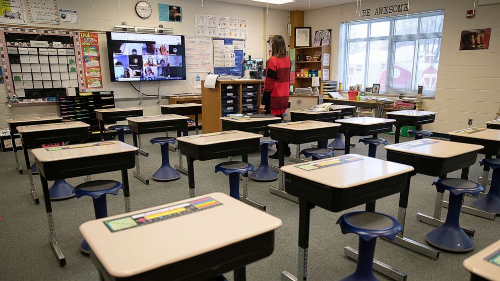PHOTO: Fourth grade teacher Kelly Brant stands in her classroom as she talks to her students who were learning remotely, Jan. 19, 2021, at Park Brook Elementary School in Brooklyn Park, Minn.