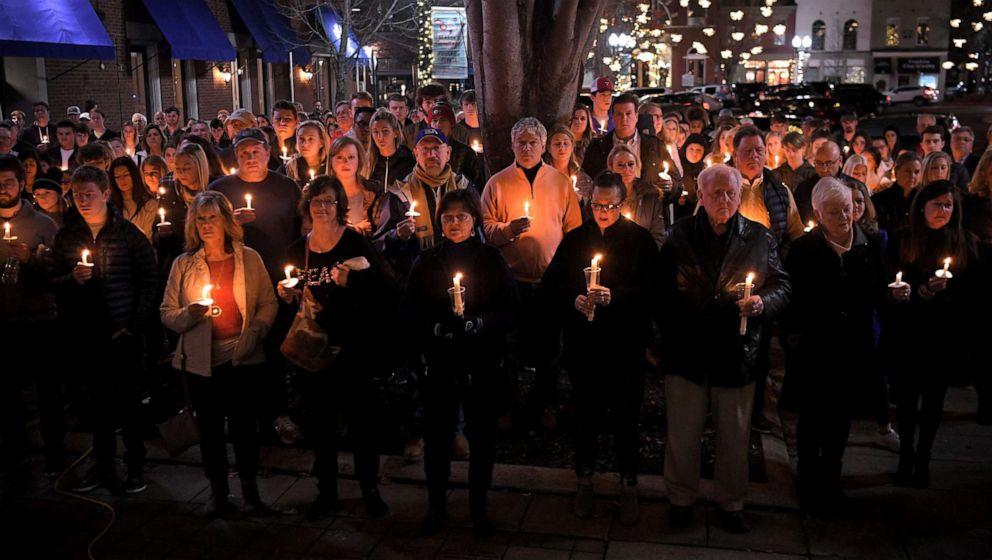 PHOTO: People gather for a candlelight vigil to honor Clayton Beathard and Paul Trapeni III on the steps of the historic Williamson County Courthouse in Franklin, Tenn., on Dec. 26, 2019.