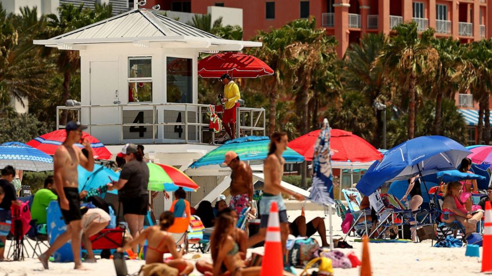 PHOTO: People visit Clearwater Beach on May 20, 2020 in Clearwater, Fla.