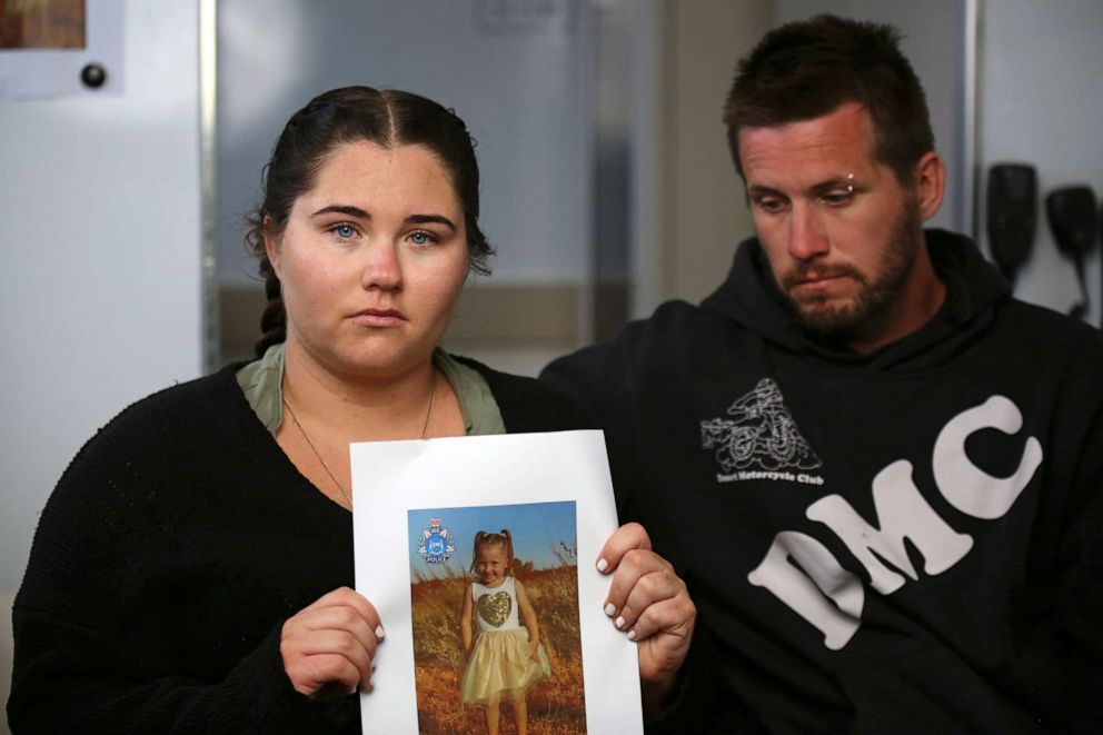 PHOTO: Ellie Smith, left, and her partner Jake Gliddon, display a photo of their missing daughter, Cleo, near Carnarvon in Western Australia state, Australia, Oct. 19, 2021.