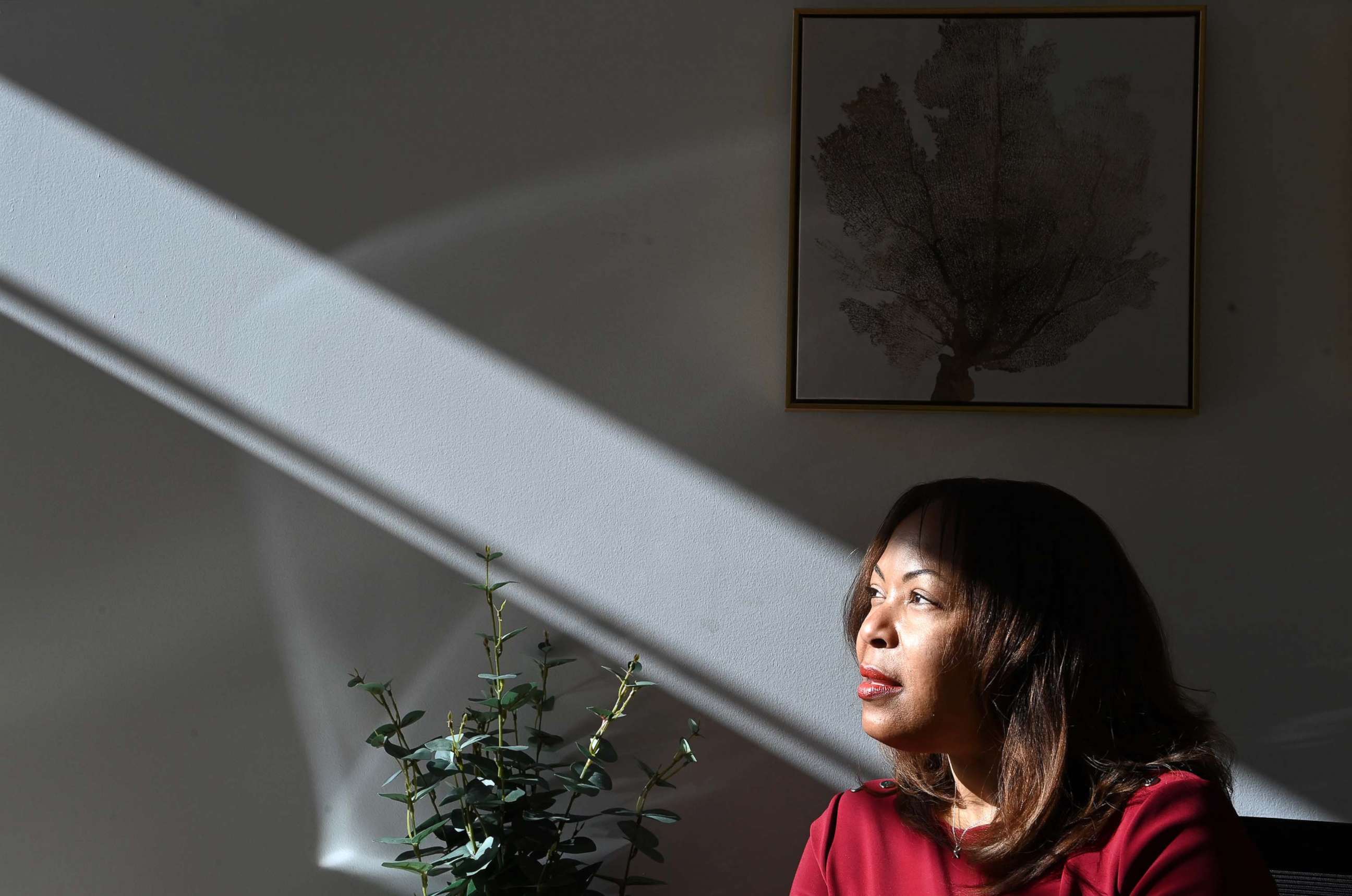 PHOTO: In this Nov. 8, 2021, file photo, public policy advisor for Blockchain Association and founder of the National Network of Women of Color in Blockchain, Cleve Mesidor, poses for a portrait in the building where she works in Washington, D.C.