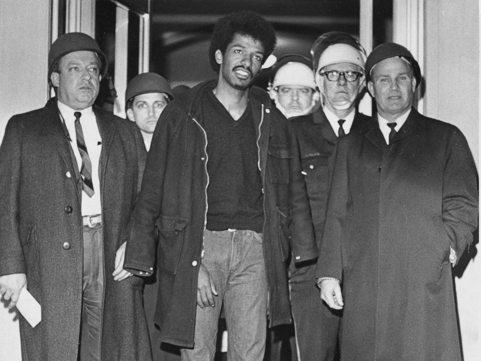 PHOTO: Cleveland Sellers, center, stands with officers after his arrest the previous night in Orangeburg, S.C., where three people were killed and others wounded, Feb. 9, 1968.