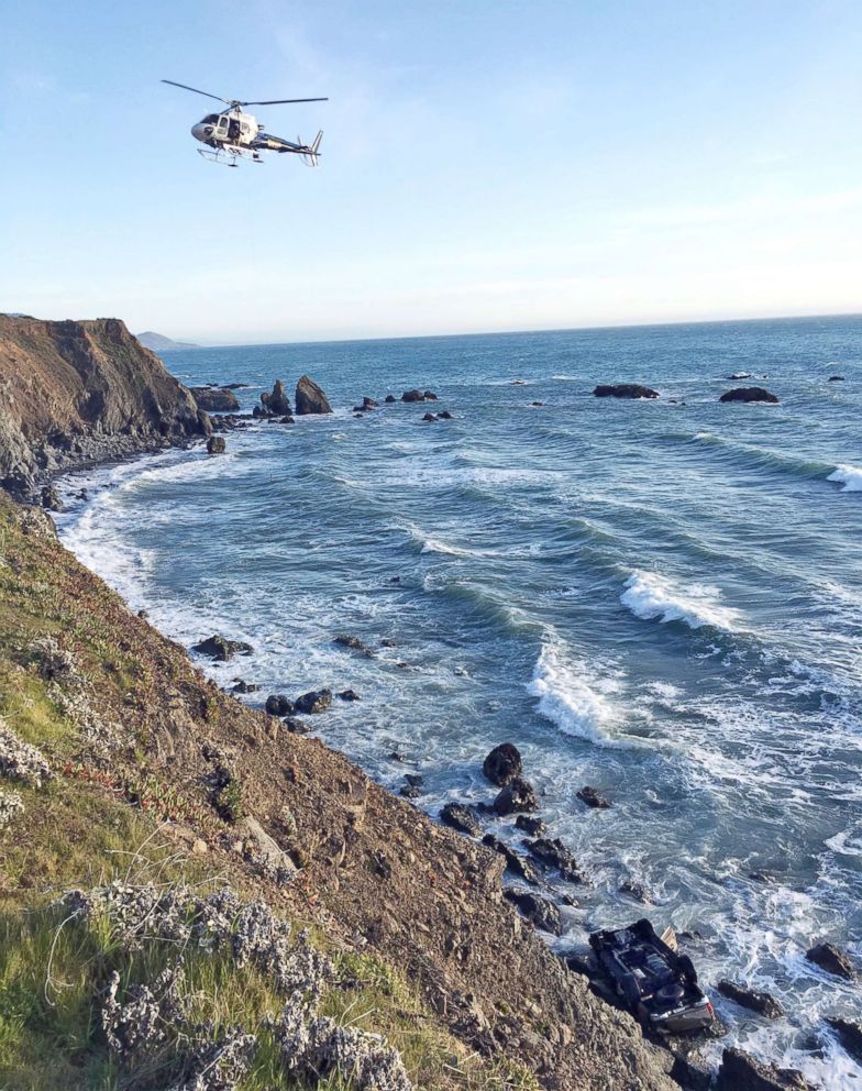 PHOTO: A helicopter hovers over the scene where a vehicle plunged off a cliff in Northern California near Mendocino, Calif., March 27, 2018.