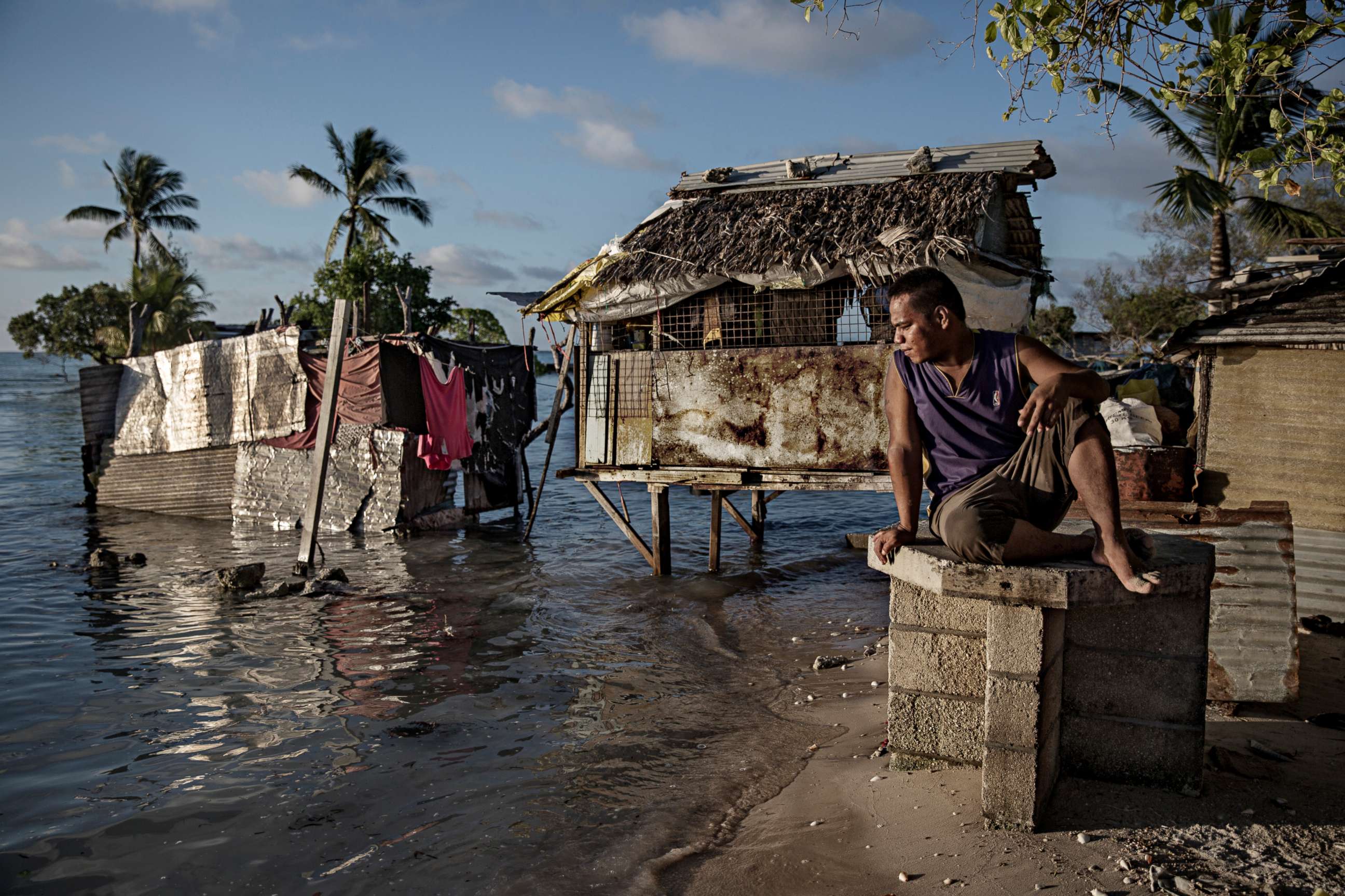 PHOTO: A resident of Eita in the Republic of Kiribati watches as ocean water slowly floods his village, on the Tarawa atoll, Sept. 30, 2015.