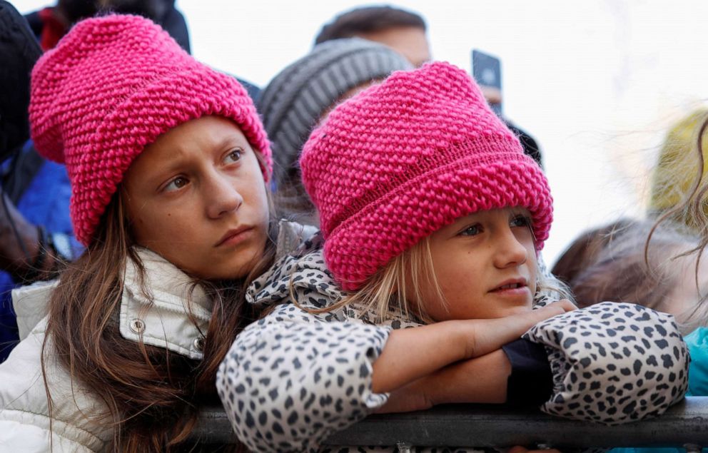 PHOTO: Two young girls listen as Swedish teen environmental activist Greta Thunberg leads a climate change rally in Charlotte, N.C., Nov. 8, 2019.