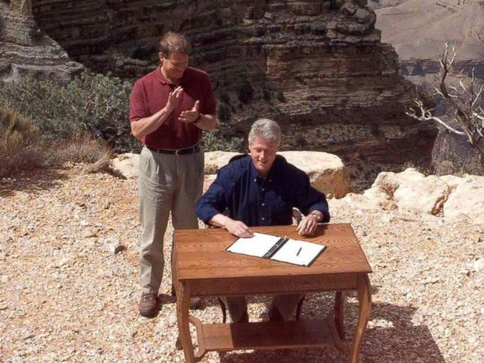 PHOTO: President Bill Clinton signs an order in Grand Canyon National Park in Arizona to designate a vast canyon-land in Utah, including Grand Escalante Staircase, a national monument, Sept. 16, 1996. Vice President Al Gore stands by his side.