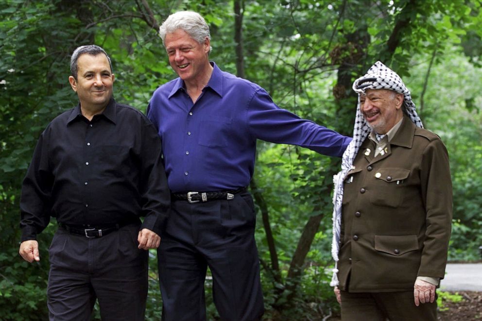 PHOTO: In this file photo, President Bill Clinton, center, accompanied by Israeli Prime Minister Ehud Barak, left, and Palestinian leader Yasser Arafat, right, walk on the grounds of Camp David, Md., on July 11, 2000, during a Mideast summit.