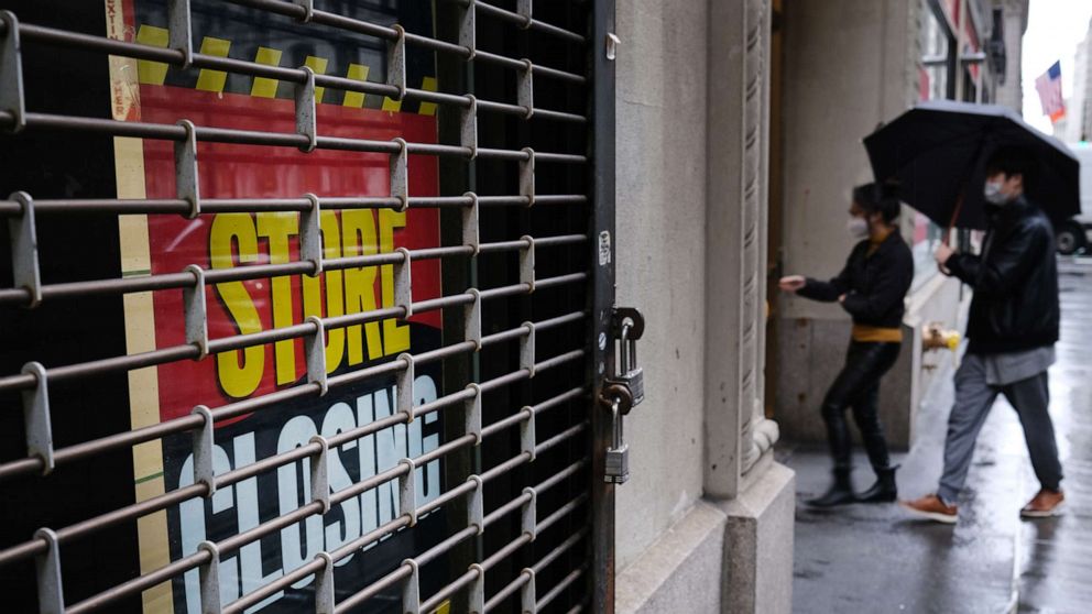 PHOTO: A store stands closed near Wall Street as the coronavirus keeps financial markets and businesses mostly closed on May 8, 2020 in New York City.