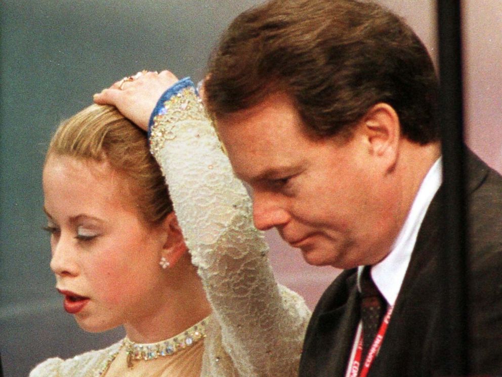 PHOTO: Coach Richard Callahan stands next to defending world and U.S. champion Tara Lipinski as judges reveal their scores following her short program routine at the U.S. National Figure Skating Championships in Philadelphia, Jan. 8, 1998.