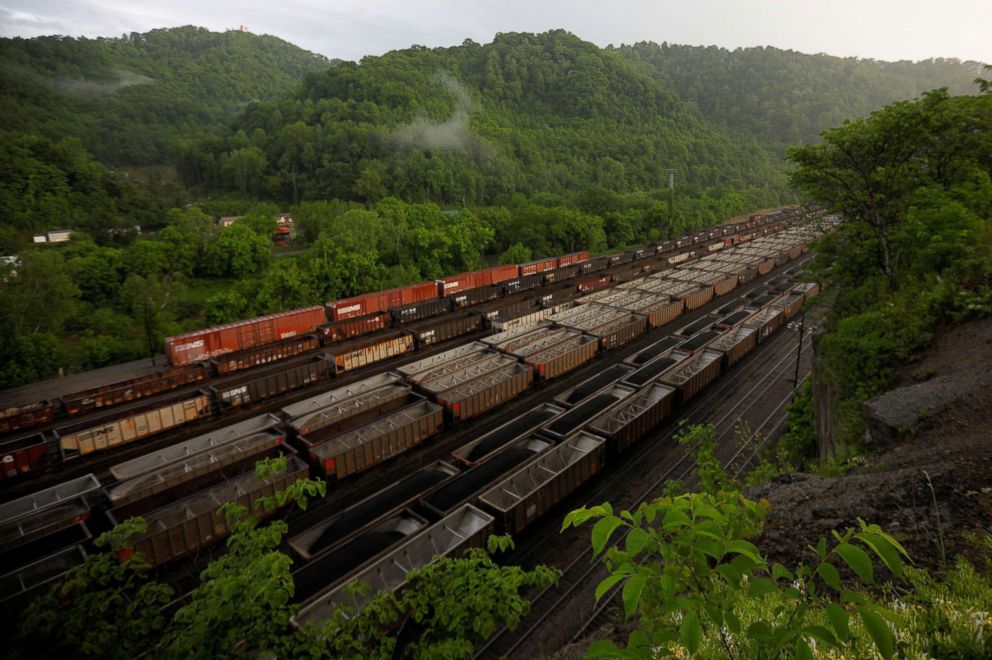 PHOTO: Train cars filled with coal wait on the tracks outside Williamson, W.Va., May 17, 2018.