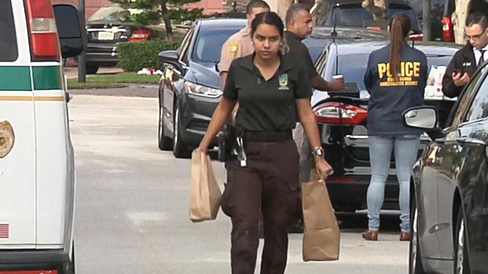 PHOTO: Investigators work at the scene in Miami-Dade County where a Coast Guard serviceman allegedly shot and killed his wife and son before killing himself, Dec. 16, 2018. His 8-year-old daughter was also critically wounded in the shooting.